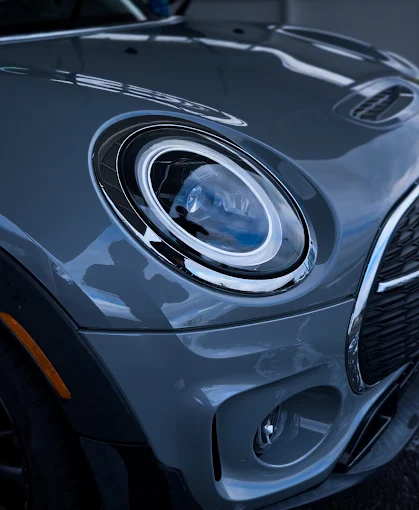 Polished Mini Cooper headlight and hood