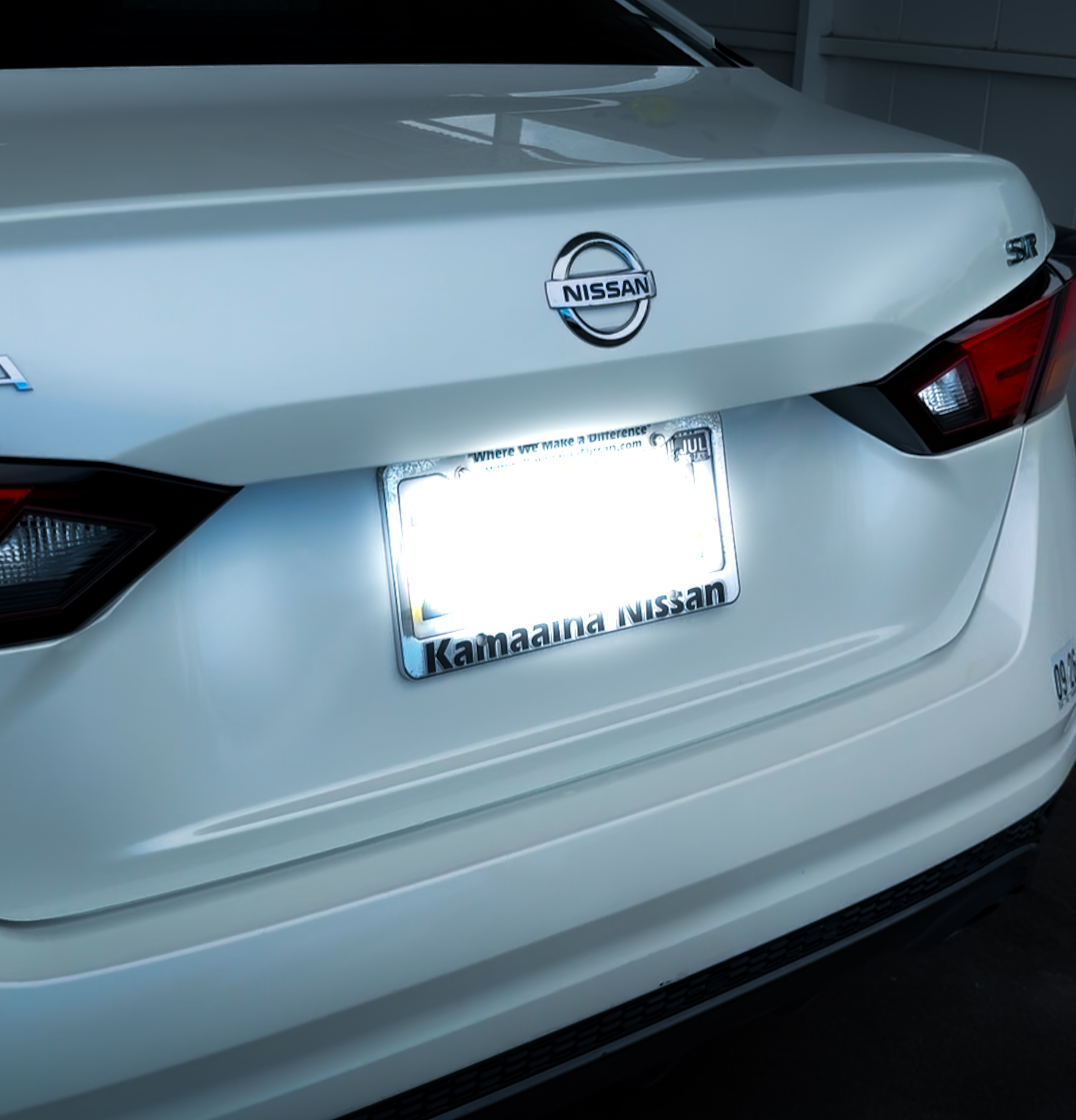 Detailed white Nissan rear exterior